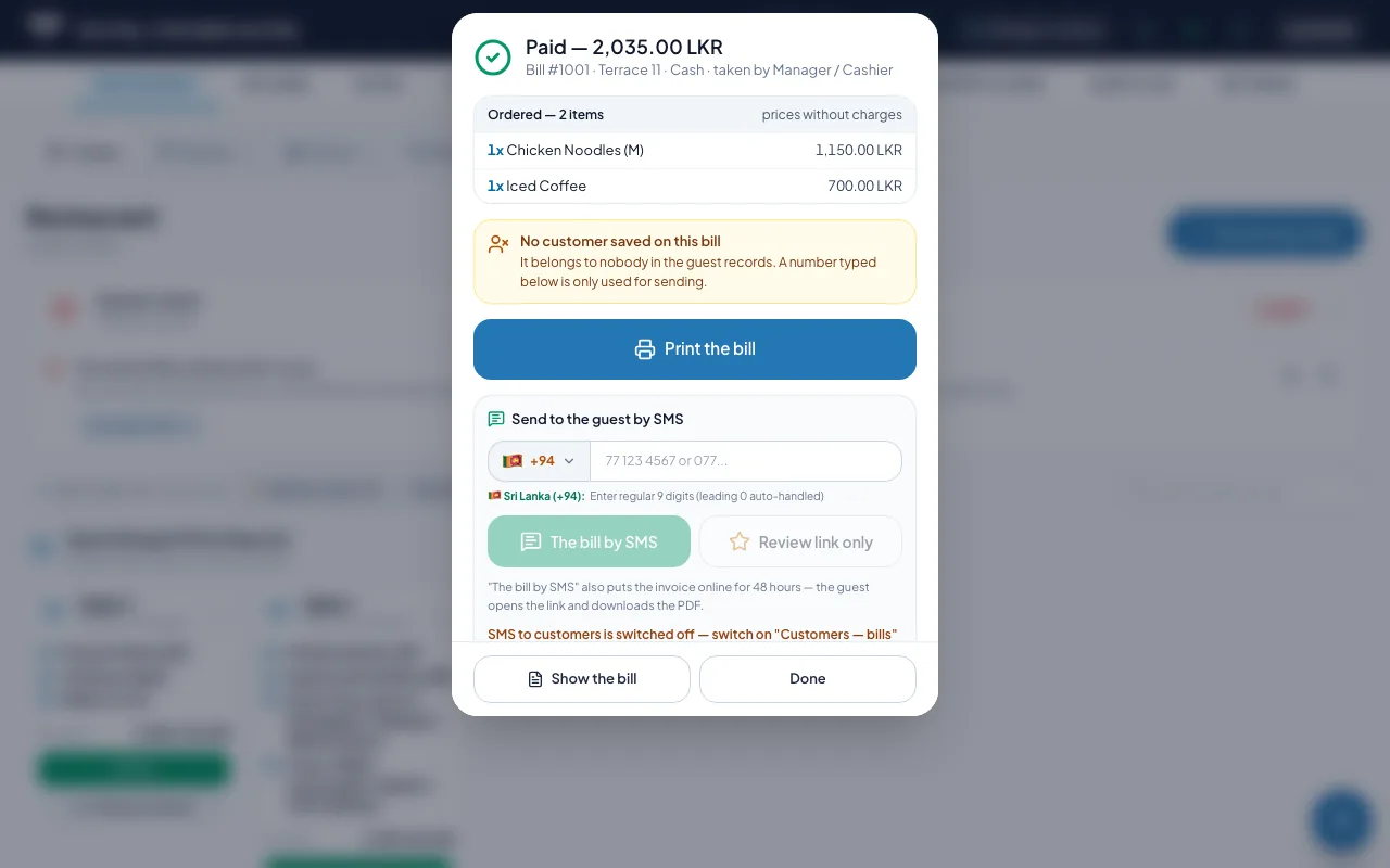 A paid bill with the buttons to print it or send it to the guest by SMS with the invoice online